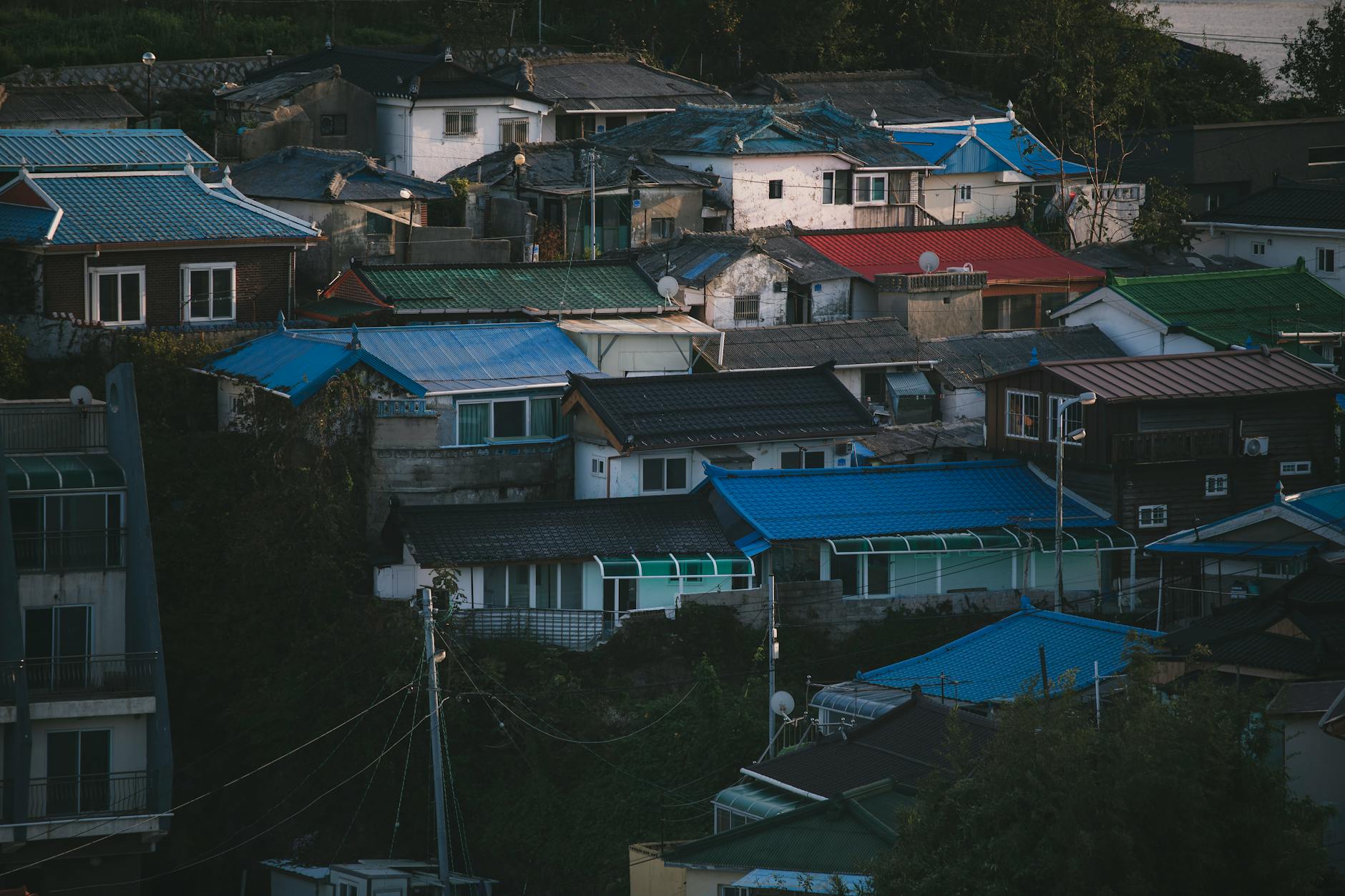 Aerial view of colorful houses in Gangneung, South Korea, showcasing a vibrant residential district.